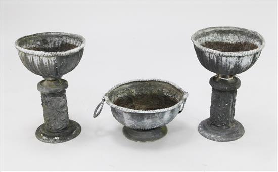 A pair of small lead garden urns, pair H.1ft 6in.